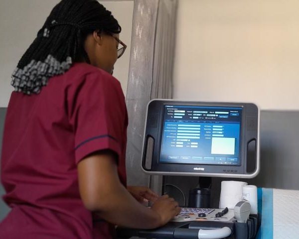 radiographer with the machine used for ultrasound scans