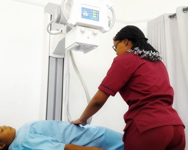 radiographer with patient